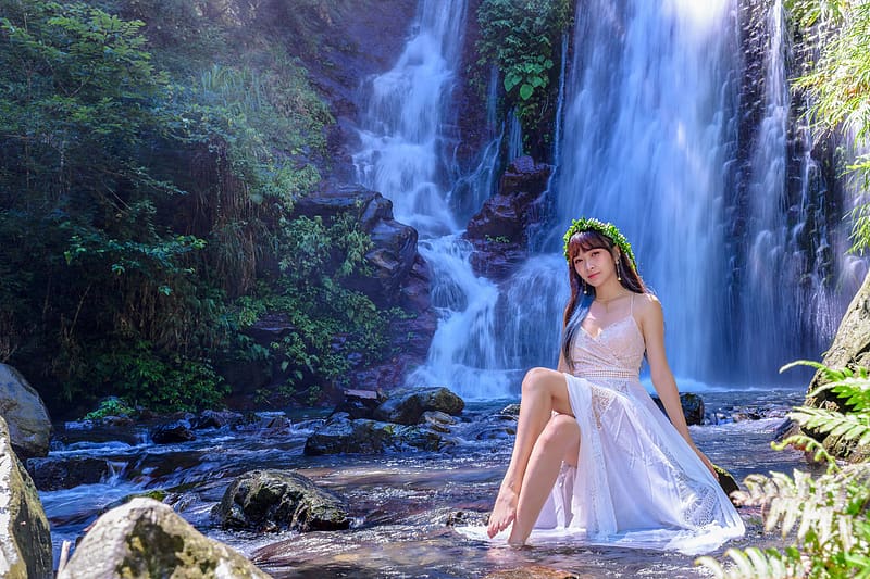 Beautiful Model Girl With Long Legs Posing Near A Waterfall Wearing Jeans  Jacket Stock Photo, Picture and Royalty Free Image. Image 120320130.
