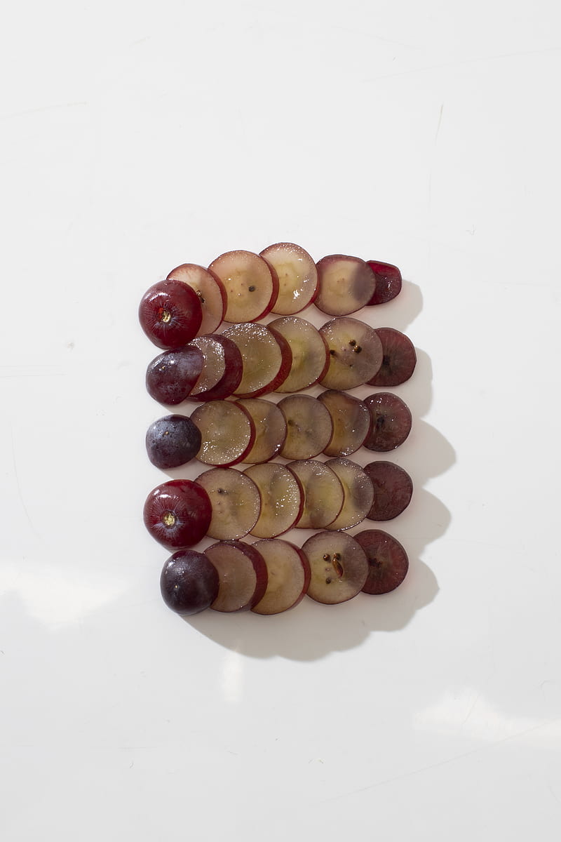 Sliced grapes arranged on white surface, HD phone wallpaper