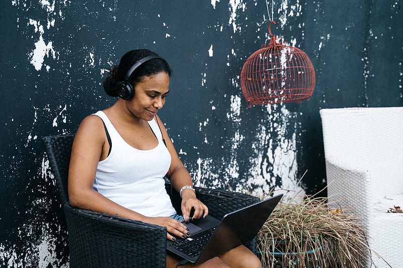 Woman in White Tank Top Sitting on Black Wicker Chair Using Macbook, HD wallpaper