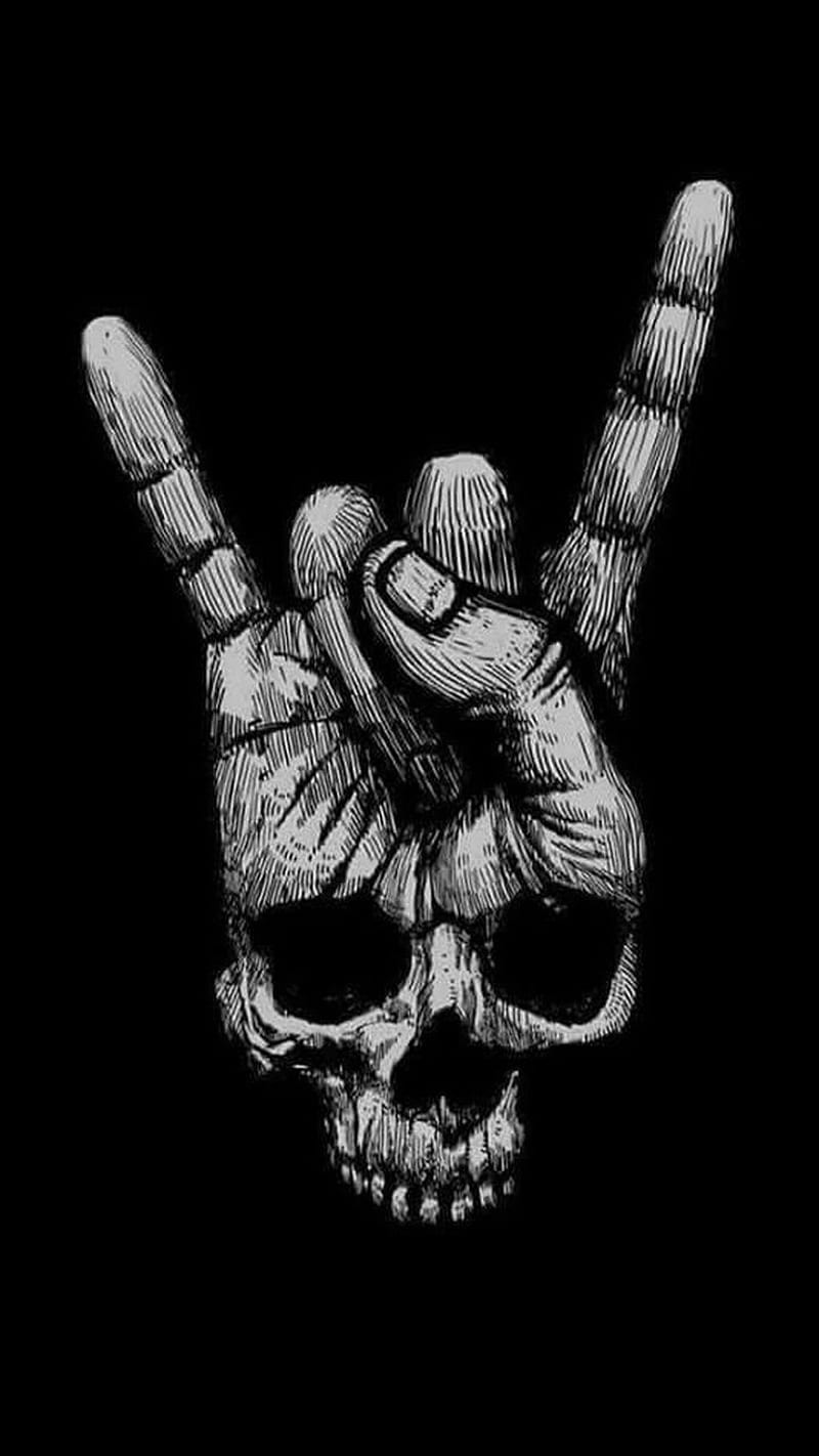 rock on skeleton hand background