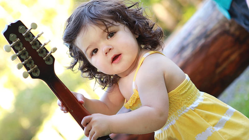 Cute Baby Girl Is Having Guitar In Hand Wearing Yellow Dress Standing In A Blur Background Cute, HD wallpaper
