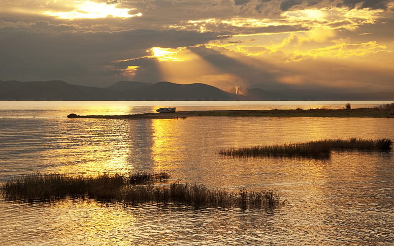 sunset on a golden lake, boat, gloden, grass, mountains, sunset, clouds, lake, HD wallpaper