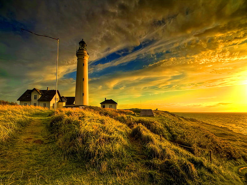 Lighthouse at sunrise, house, sun, golden, sunlight, yellow, sunset, sky, clouds, lighthouse, summer, nature, sunrise, sunshine, field, HD wallpaper