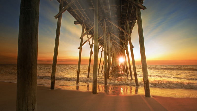 sunset under a wooden pier, beach, pier, logs, sunset, waves, fog, sea, HD wallpaper