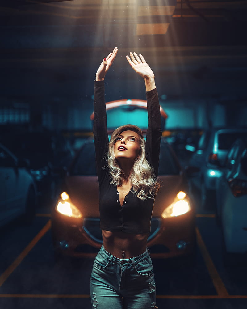 women, model, blonde, portrait display, black tops, cleavage, belly, pierced navel, jeans, torn jeans, arms up, ribs, looking up, lights, frontal view, depth of field, parking, parking lot, car, women with cars, smiling, Peugeot, Peugeot 208, headlight beams, HD phone wallpaper