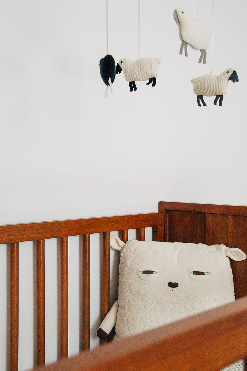 crib with sheep pillow and crib mobile, HD phone wallpaper