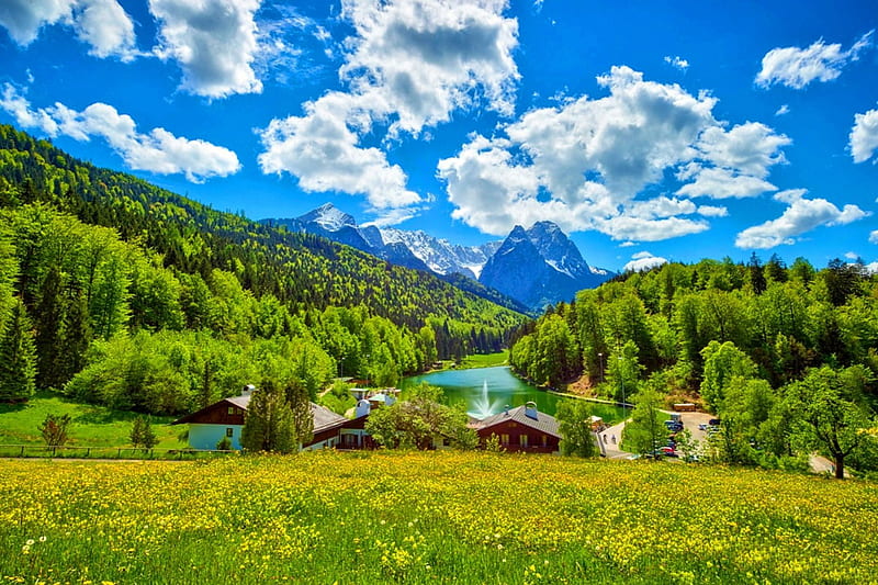 Riessersee, Upper Bavaria, forest, houses, yellow, bonito, spring, sky, clouds, lake, green, mountains, wildflowers, pasture, Germany, white, blue, HD wallpaper