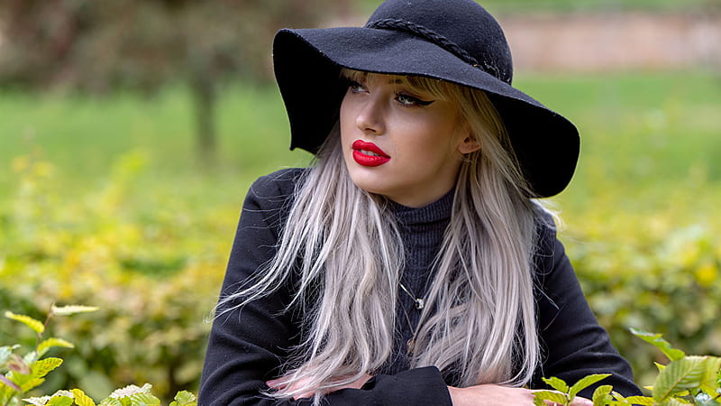 White Hair Girl Model Is Standing In Blur Green Background Wearing Blue