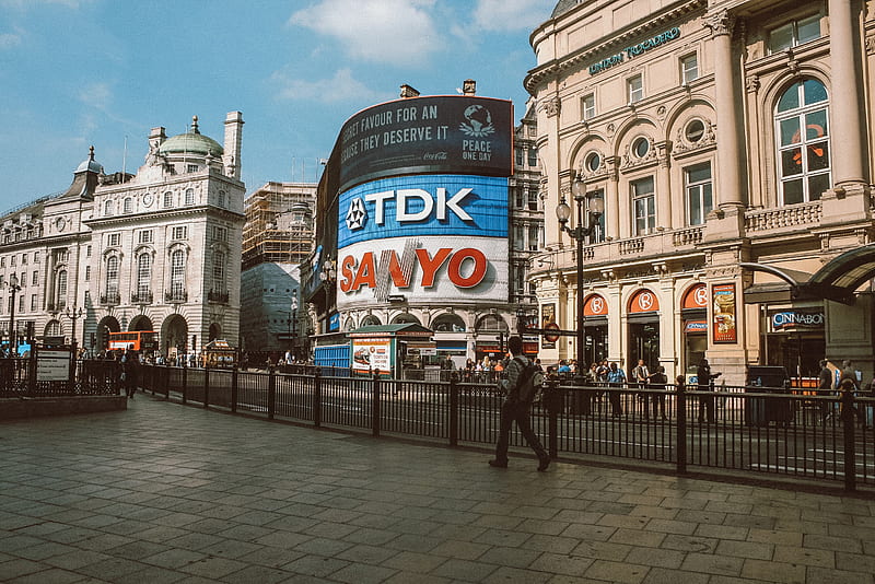 people walking near TDK and Sanyo building under blue and white skies, HD wallpaper