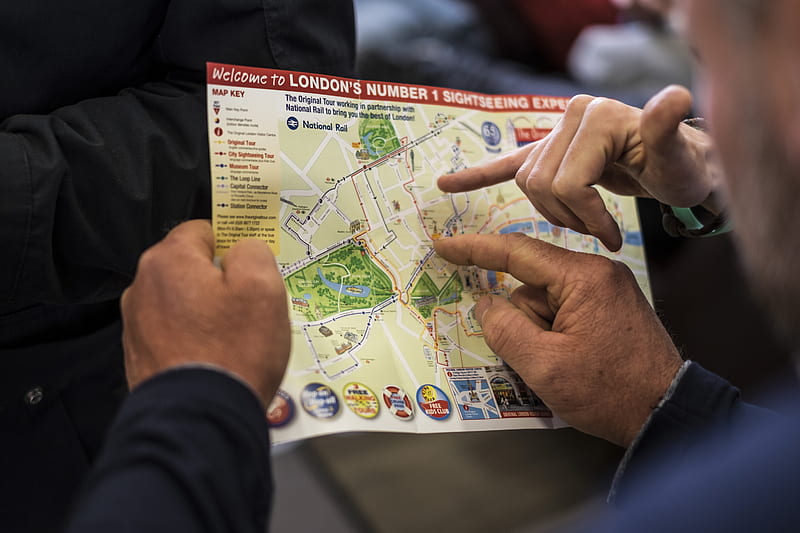 two people pointing at London's number one sightseeing map, HD wallpaper