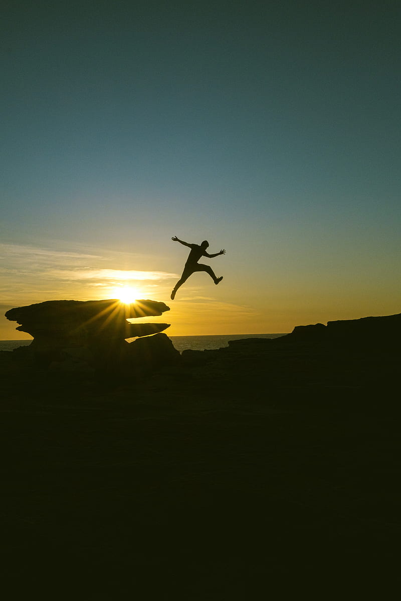 Man, jump, rocks, sunset, HD phone wallpaper | Peakpx