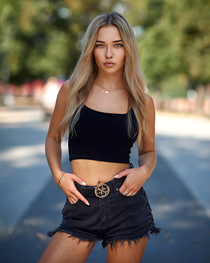 Bulinko Piotr, women, blonde, long hair, looking at viewer, jewelry, gold, necklace, tank top, black clothing, bracelets, shorts, hands in pockets, outdoors, depth of field, black tops, short tops, frontal view, HD phone wallpaper