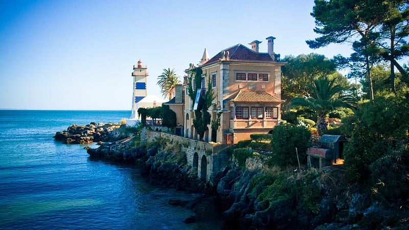 mansion by a lighthouse on a rocky seacoast, rocks, mansion, trees, coast, lighthouse, sea, HD wallpaper