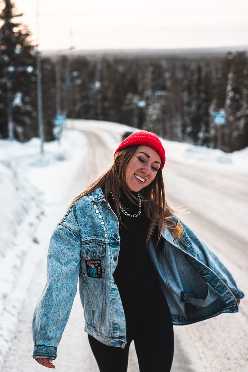 woman in blue denim jacket and red knit cap standing on snow covered ground during daytime, HD phone wallpaper