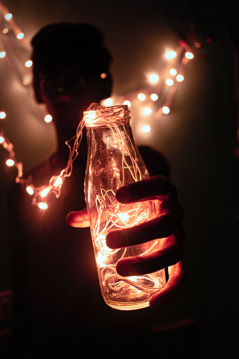 person holding bottle with string lights, HD phone wallpaper