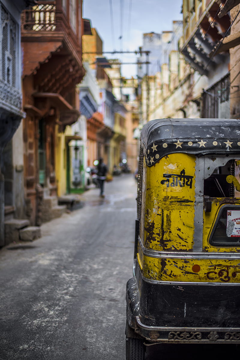 selective focus graphy of yellow auto rickshaw on road, HD phone wallpaper