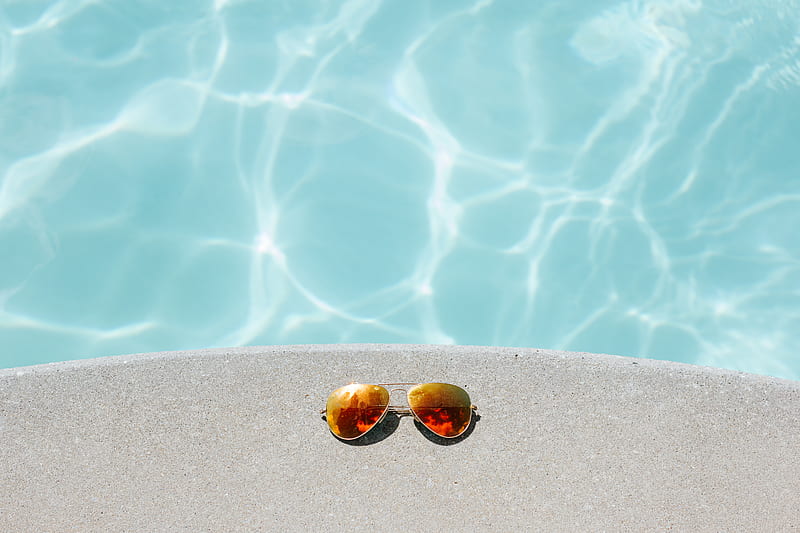 gold framed orange lens Aviator-style sunglasses beside pool, HD wallpaper