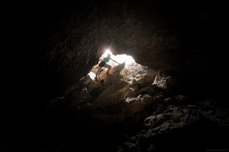 Person standing on rocks near cave, HD wallpaper | Peakpx
