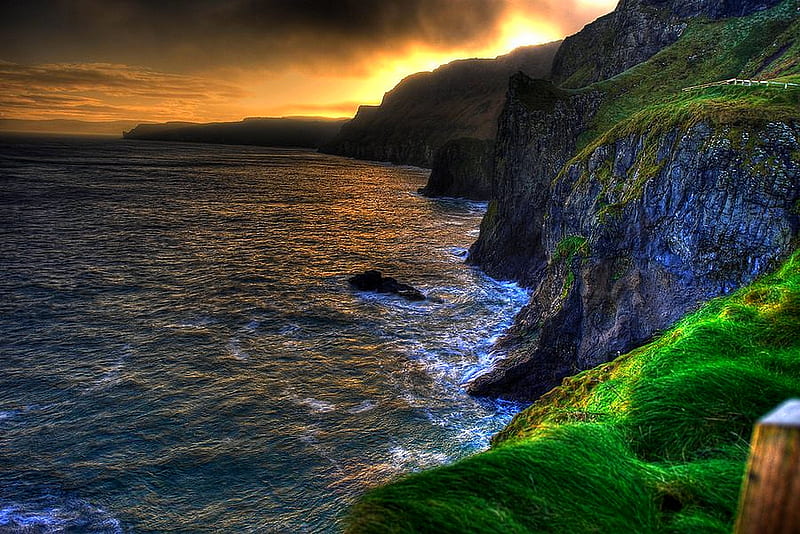 AT THE EDGE OF THE OCEAN, rock, grass, ocean, rocky, sunset, plants, moss, cliff, hill, HD wallpaper