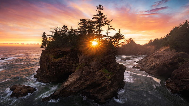 Sun setting behind a tree covered sea stack on the Oregon Coast, rock, sunset, clouds, trees, colors, sky, usa, HD wallpaper
