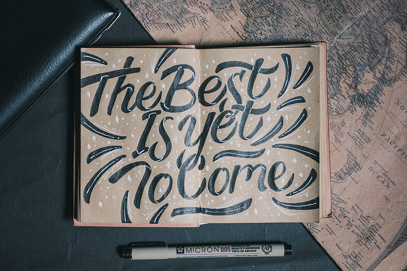 the best is yet to come-printed board beside white pen, HD wallpaper