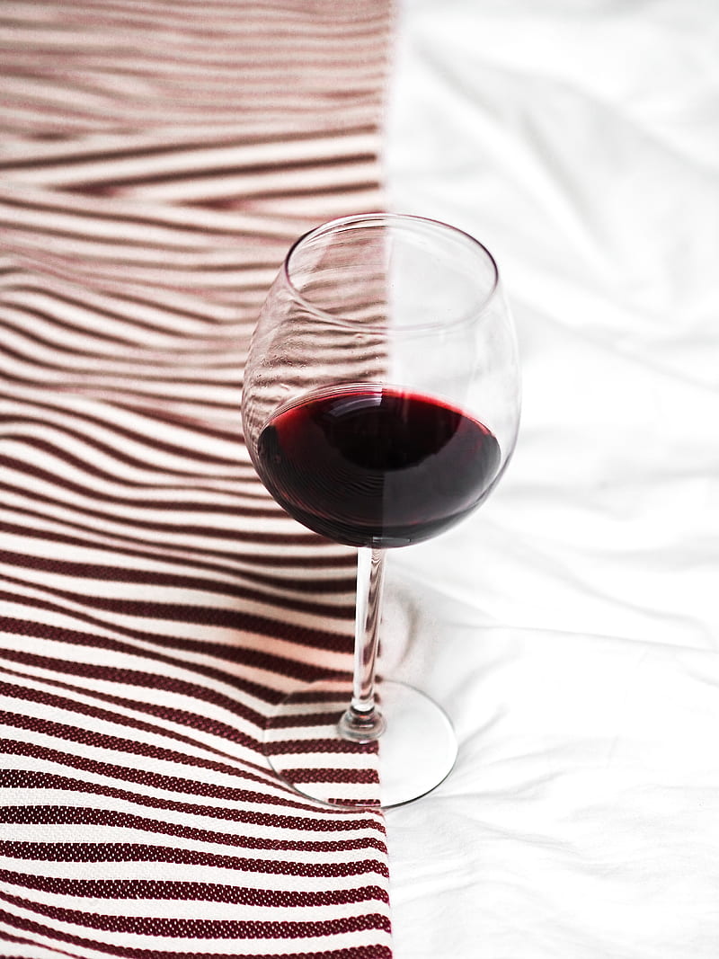 clear wine glass with red wine on white and black stripe textile, HD phone wallpaper