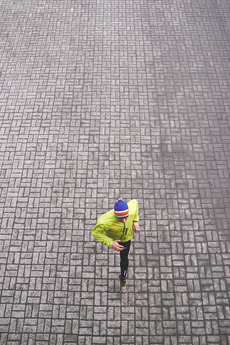 person in green track jacket running, HD phone wallpaper
