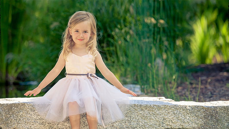 Cute Little Girl Is Wearing White Dress Sitting On Stone Pavement In Green Blur Background Cute, HD wallpaper
