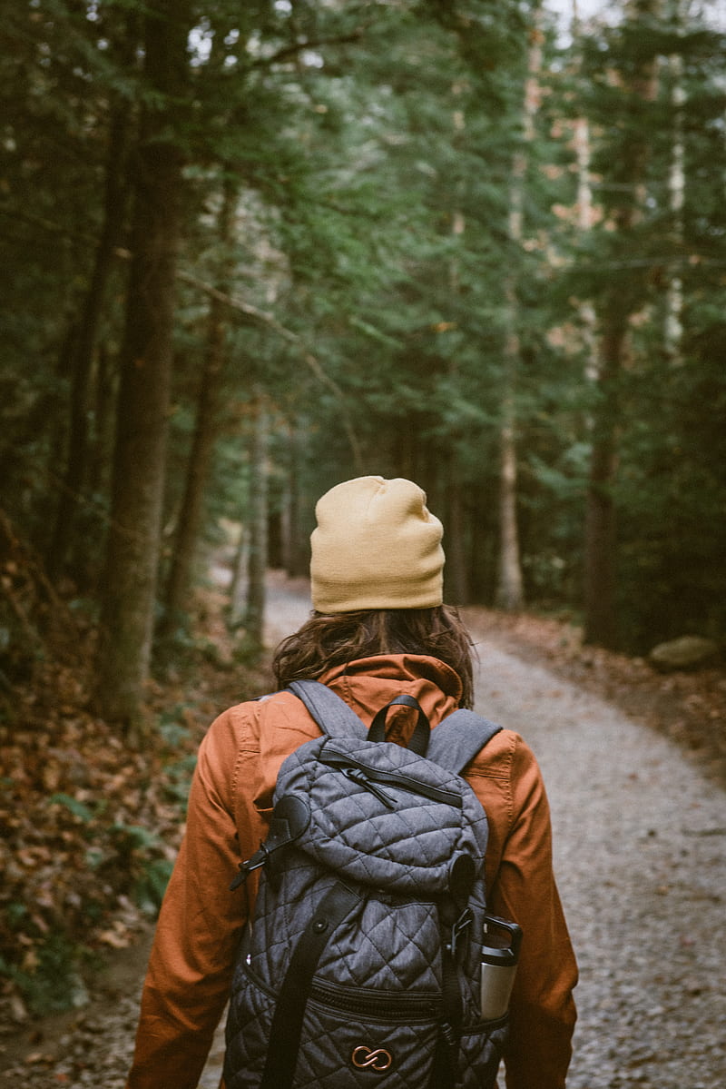 woman carrying backpack walking towards the forest, HD phone wallpaper