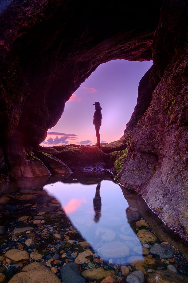 man standing in front of cave, HD phone wallpaper