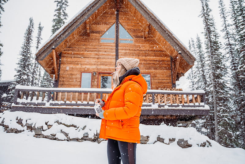 woman in orange jacket standing on snow covered ground, HD wallpaper