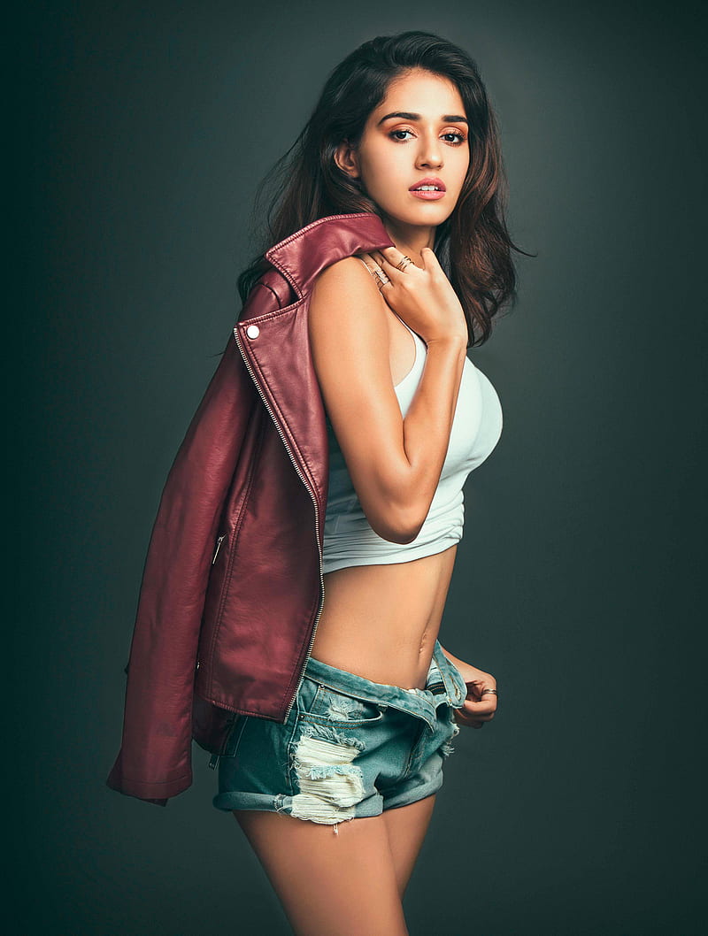 Disha Patani, women, actress, model, Bollywood actresses, Bollywood, Indian, brunette, long hair, simple background, legs, jean shorts, short shorts, torn jeans, holding jacket, red jackets, open shorts, dark hair, blue shorts, blue pants, standing, HD phone wallpaper
