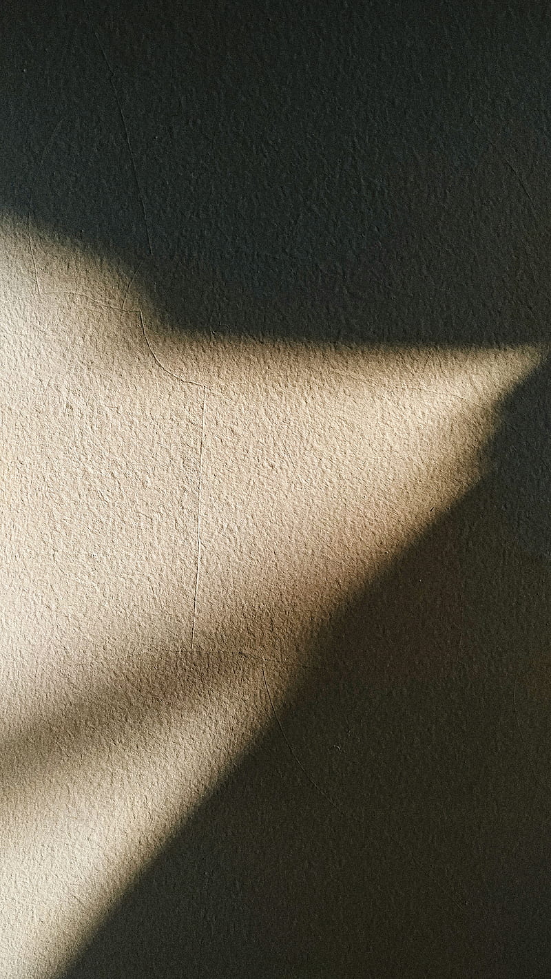 Sunlight from little part of window illuminating dark room with rough gray surface creating shadow on wall, HD phone wallpaper