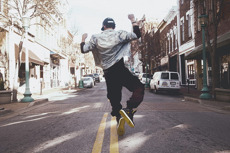 man jumping on the middle of the street during daytime, HD wallpaper