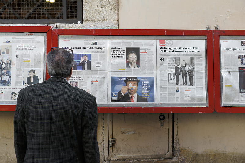 man reading newspaper in bulletin board, HD wallpaper