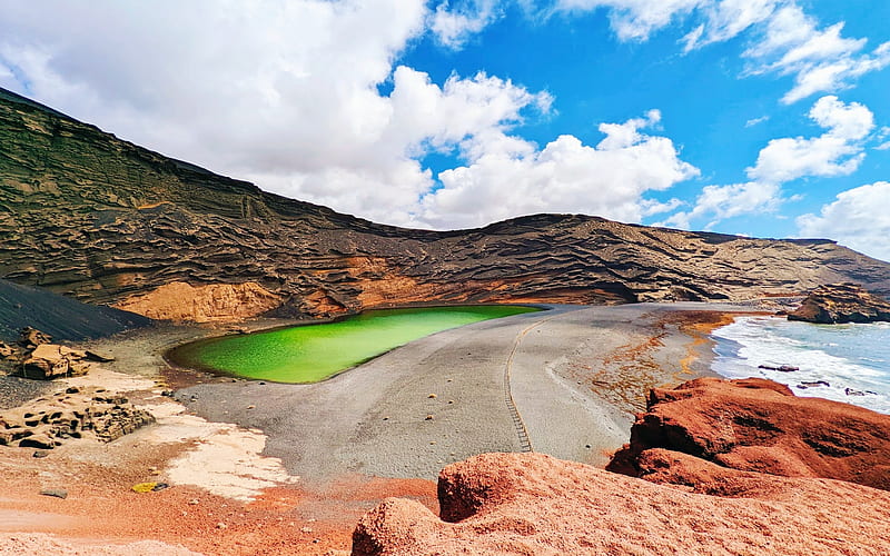 Emerald green lake next to azure blue sea in Lanzarote, stones, coast, beach, hills, clouds, sky, HD wallpaper