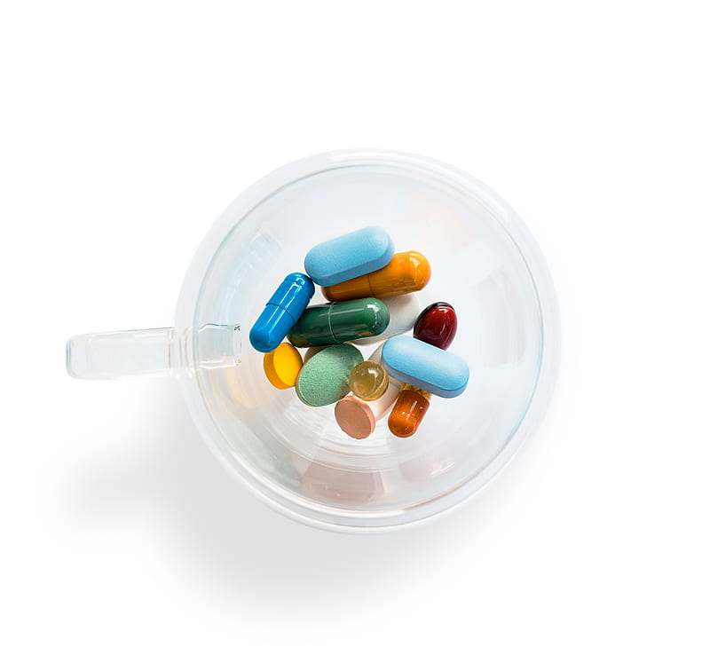 green and white medication pill in clear glass container, HD wallpaper