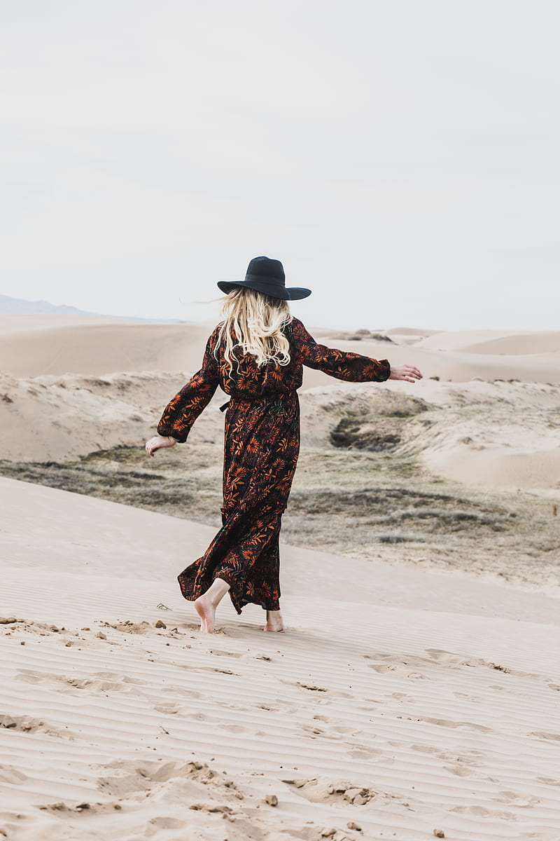 person wearing brown and orange floral maxi dress walking barefooted along deserted land, HD phone wallpaper