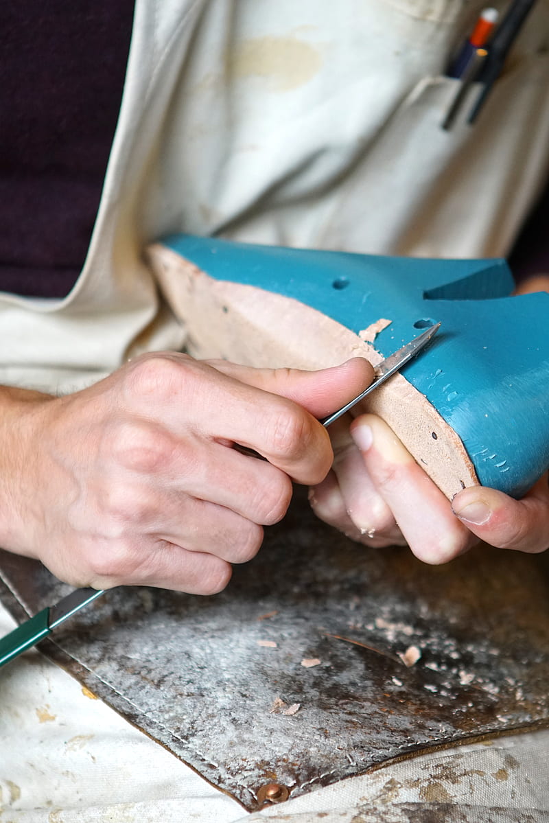 person carving blue footwear, HD phone wallpaper
