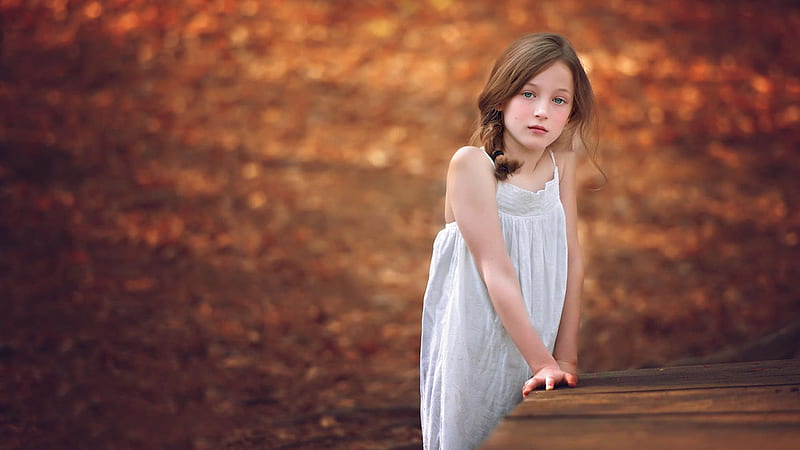 Sad Looking Little Girl Is Wearing White Dress In Blur Dry Leaves Background Sad, HD wallpaper