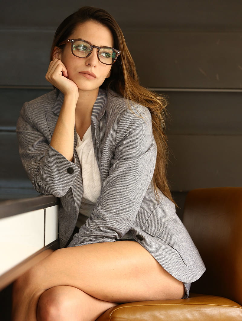Génesis Rodríguez, women, actress, brunette, long hair, legs, women with glasses, sitting, indoors, HD phone wallpaper