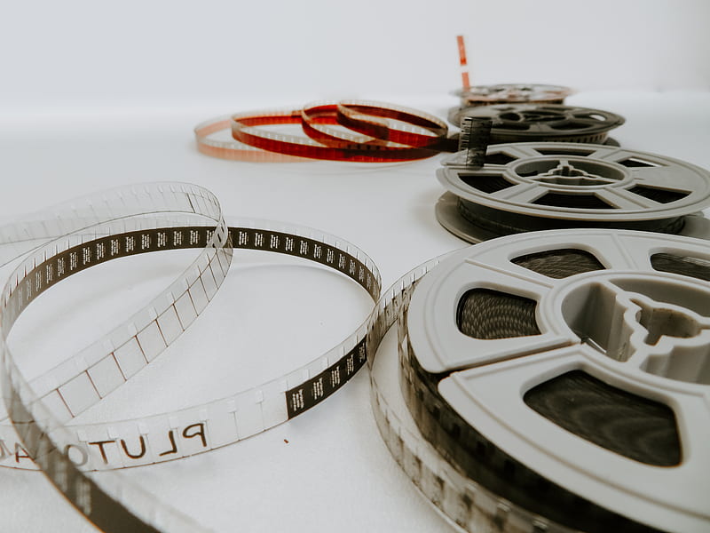 four reel films lying on white table, HD wallpaper