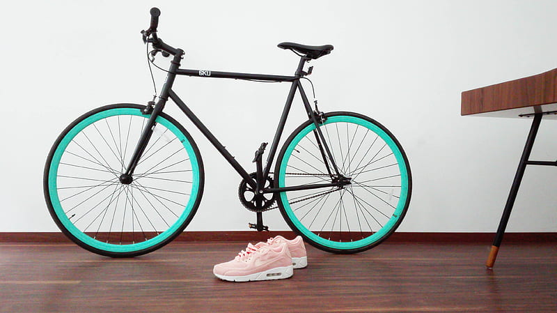 black and green road bike near pair of pink-and-white Nike Air Max Command, HD wallpaper