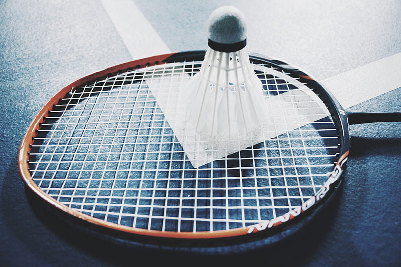 white shuttlecock on brown and black badminton racket placed on floor, HD wallpaper