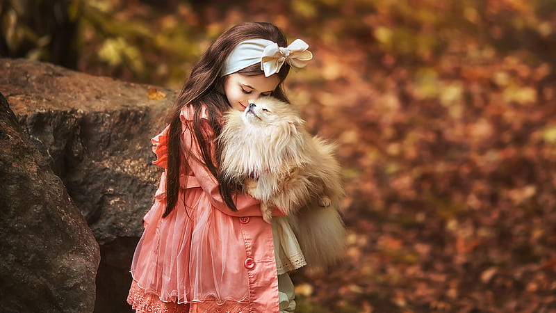 Cute Girl Is Wearing Coral Color Dress Having Head Band Kissing Puppy In A Blur Background Cute, HD wallpaper