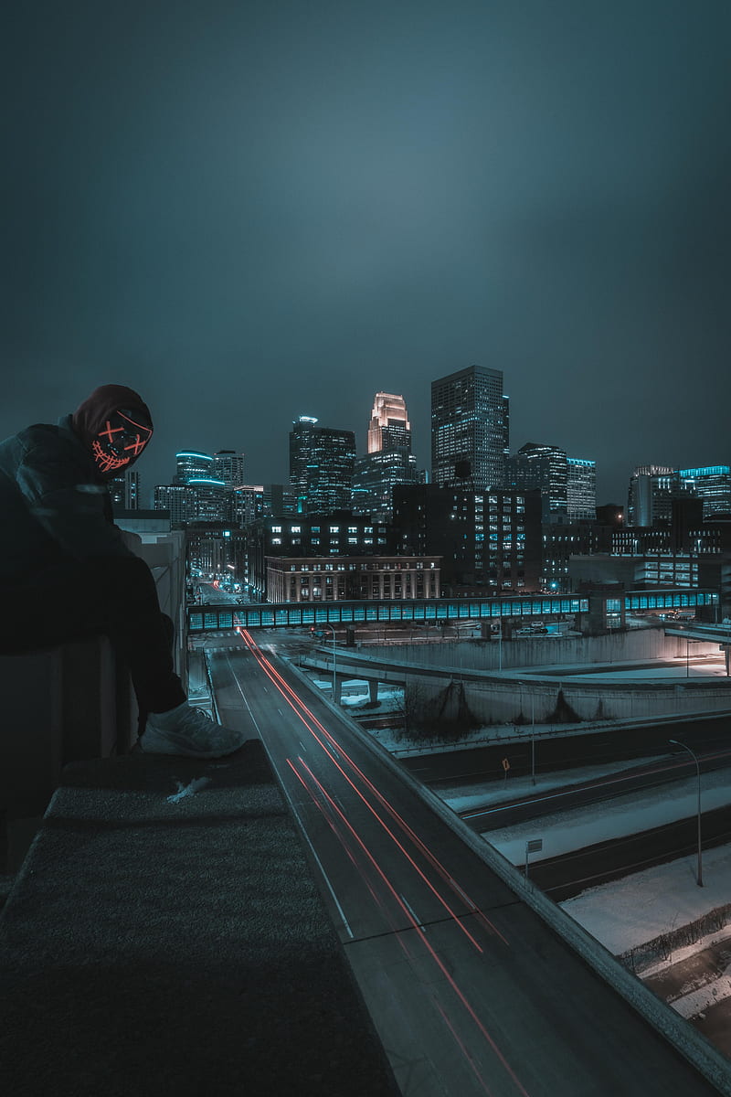 man in black hoodie standing on the train rail during night time, HD phone wallpaper