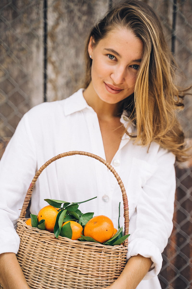 Woman in White Dress Shirt Holding Basket of Fruits, HD phone wallpaper