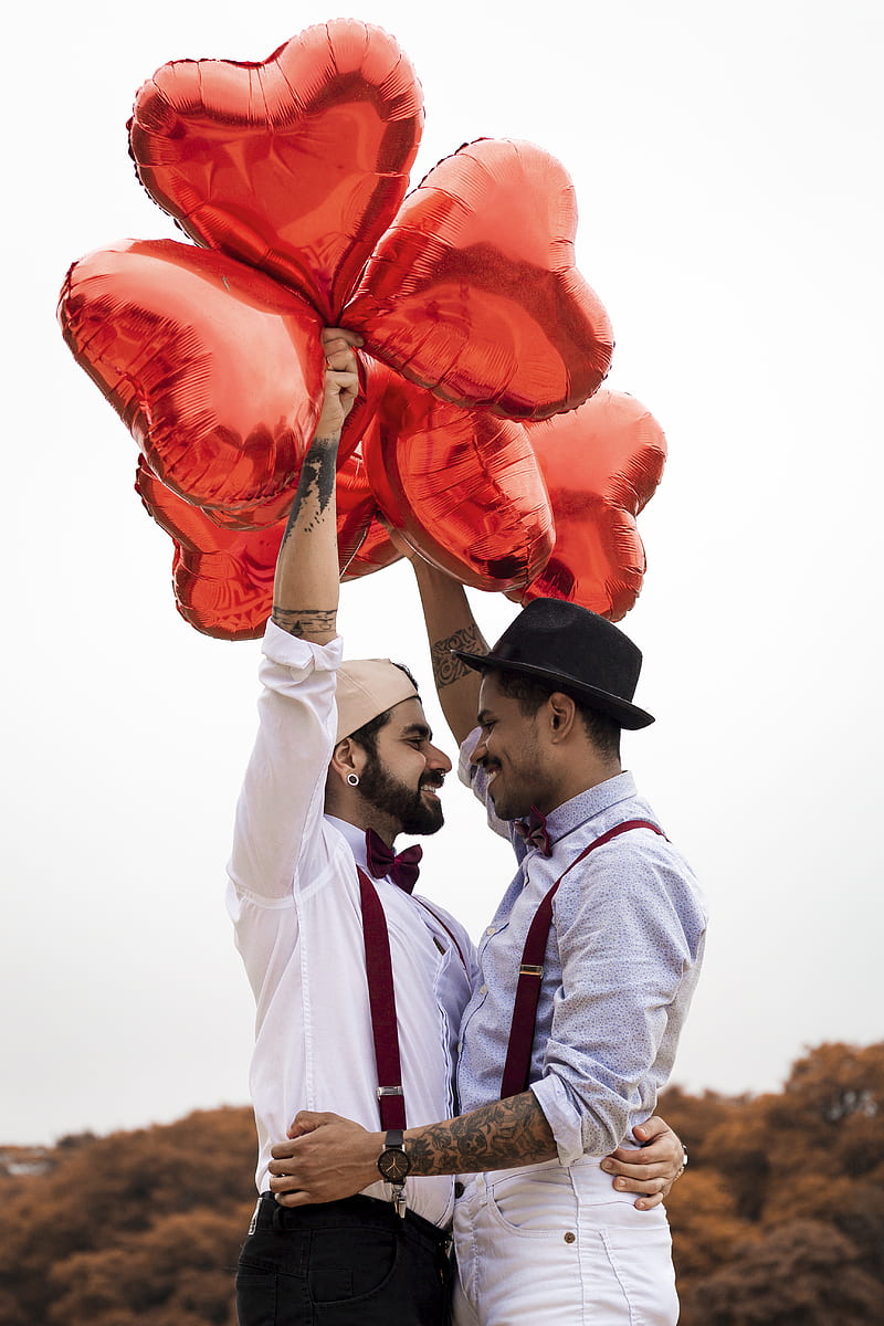 Two Men Embracing while Holding Heart Balloons, HD phone wallpaper