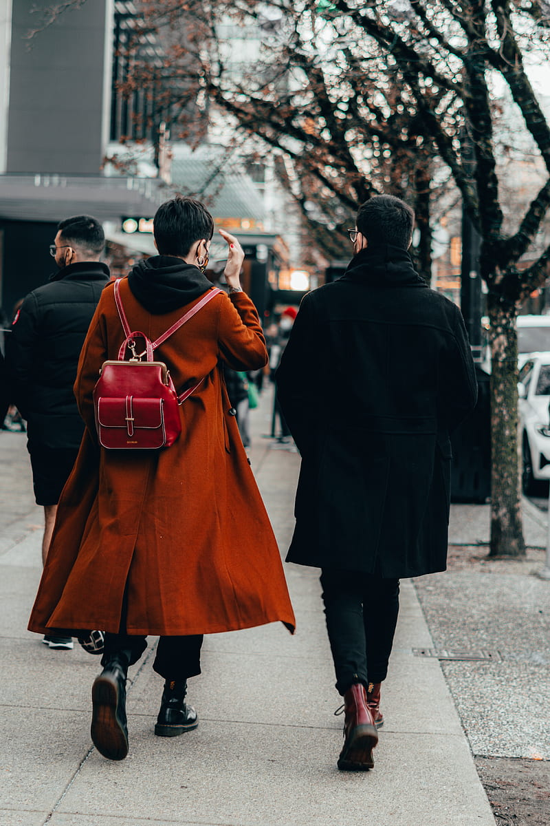 Man in black coat walking on sidewalk during daytime, HD phone