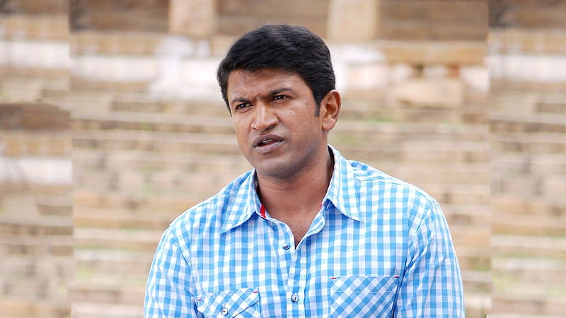 Actor Puneeth Rajkumar Is Wearing White Blue Checked Shirt Sitting In Blur Background Puneeth Rajkumar, HD wallpaper